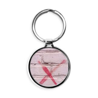 X Marks the Spot on a Brick Wall Circle Keychain